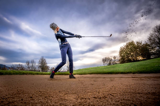 mature female model at golf course - baseball cap cap hat golf hat imagens e fotografias de stock