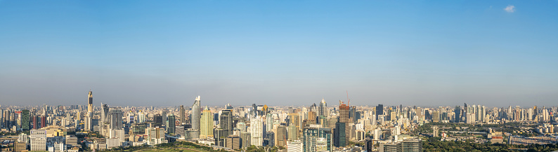 Panorama landscape view of Bangkok city and business urban downtown with blue sky , Cityscape capital and financial district center of Bangkok, Thailand