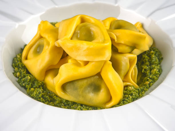 istock Fresh tortelloni with pesto sauce 1202745590