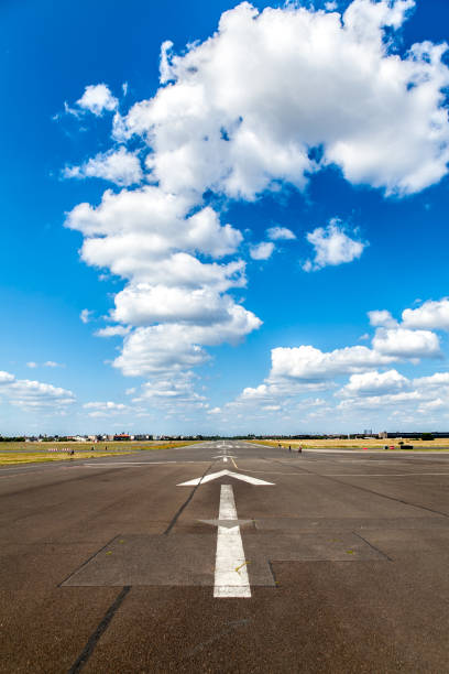istock airport runway against cloudy blue sky 1202746947