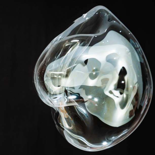 istock Colorful creative amorphous soap bubble floating with a black background 1202749139
