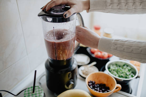 istock Preparing healthy fruit and vegetable smoothie at home 1202751943