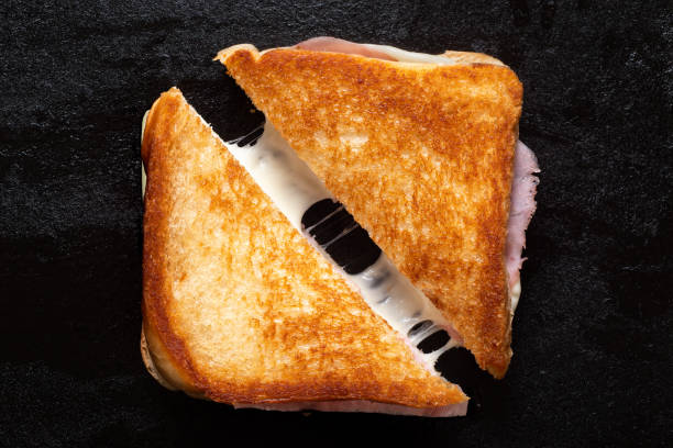 cheese and ham toasted sandwich. - stringy imagens e fotografias de stock