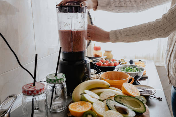 istock Preparing healthy fruit and vegetable smoothie at home 1202752176