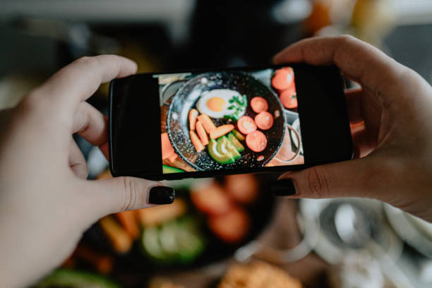 istock Photographing fried egg with vegetables in the kitchen 1202752364