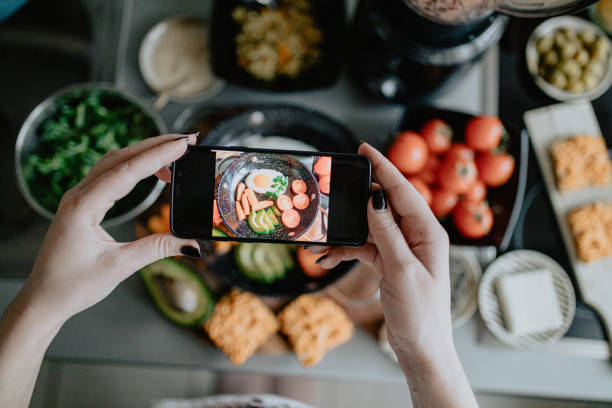 istock Photographing fried egg with vegetables in the kitchen 1202752431