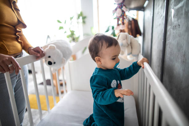 istock Baby boy in the crib 1202753614