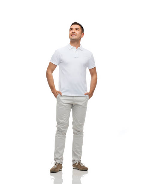istock smiling man with hands in pockets looking up 1202753849