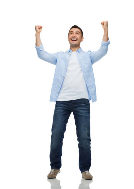 istock happy laughing man with raised hands 1202754147
