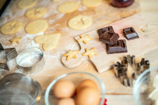istock Woman baking at home: Cookies preparation ingredients 1202755106