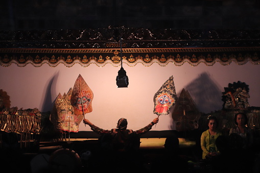 “Magelang, Indonesia – October 04, 2019 : \nWayang Indonesian performance art in Magelang traditional night festival. Wayang is a native Indonesian performance art that is growing rapidly in Java and Bali.  The show is also popular in areas such as Sumatra and the Malay Peninsula, and also has a number of wayang cultures that are influenced by Javanese and Hindu culture.\
