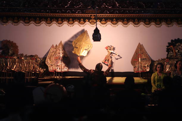Wayang Indonesian performance art in Magelang traditional night festival. “Magelang, Indonesia – October 04, 2019 : 
Wayang Indonesian performance art in Magelang traditional night festival. Wayang is a native Indonesian performance art that is growing rapidly in Java and Bali.  The show is also popular in areas such as Sumatra and the Malay Peninsula, and also has a number of wayang cultures that are influenced by Javanese and Hindu culture." wayang kulit photos stock pictures, royalty-free photos & images