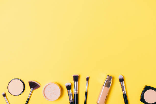 istock Makeup background powders, concealers and professional brushes 1202758968