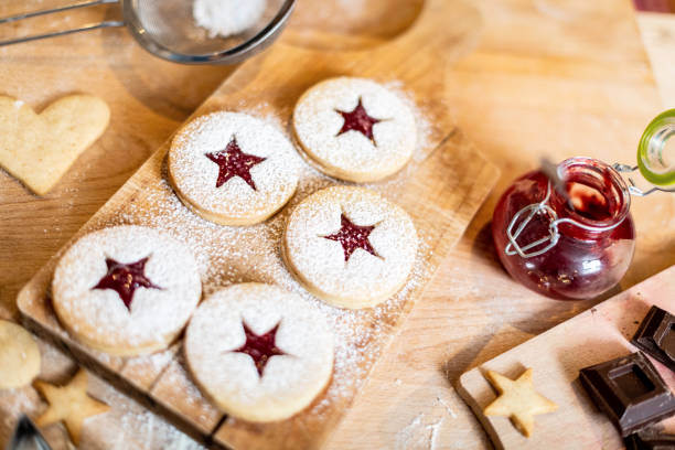 Woman baking at home: Cookies preparation ingredients