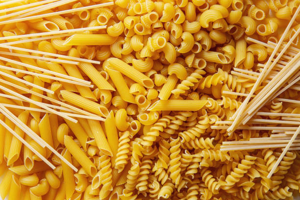 istock Top view Heap of various uncooked pasta 1202763995