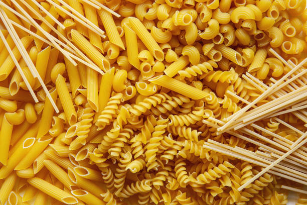 istock Top view Heap of various uncooked pasta 1202764002