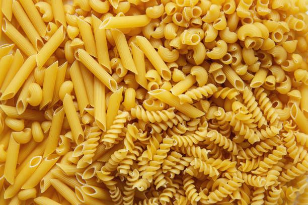 istock Top view Heap of various uncooked pasta 1202764190