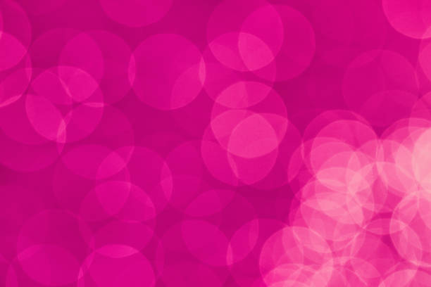 istock Vibrant pink color wallpaper abstract bokeh light defocused background 1202766924