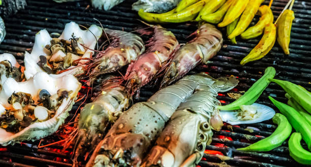 istock Lobster Barbecue Fire Grill Food Background 1202770080