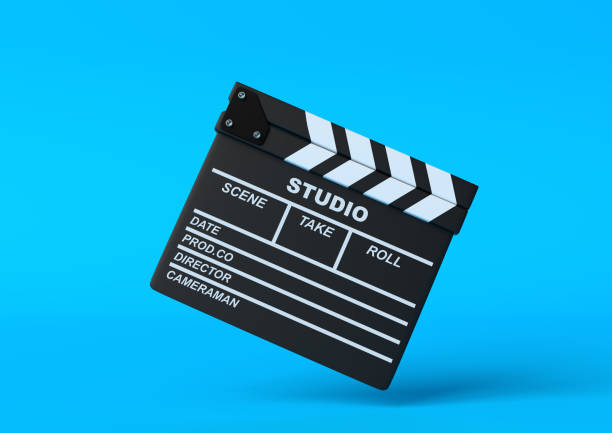 istock Flying lapperboard isolated on bright blue background in pastel colors 1202770137