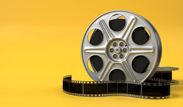 Film reel isolated on bright yellow background in pastel colors Film reel isolated on bright yellow background in pastel colors. Minimalist creative concept. Cinema, movie, entertainment concept. 3d render illustration yellow tape audio stock pictures, royalty-free photos & images