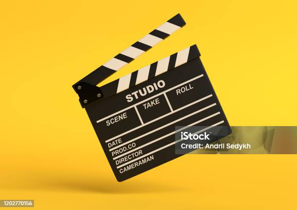 Flying Lapperboard Isolated On Bright Yellow Background In Pastel Colors Stock Photo - Download Image Now