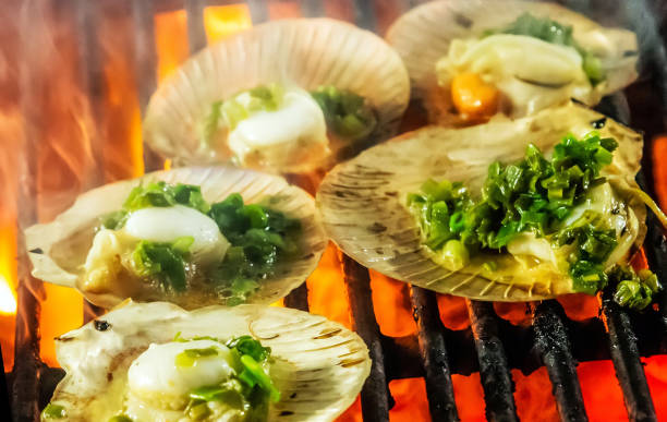 istock Cooking grilling scallop seashell mussel oyster 1202770266