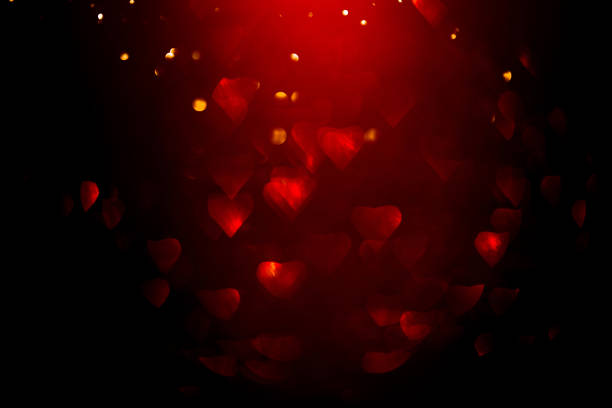 istock Background with red bokeh in the shape of a heart. 1202772636