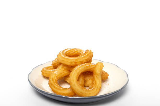 istock Cup of chocolate sauce with churros 1202774612