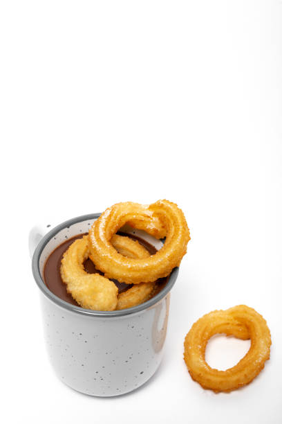 istock Cup of chocolate sauce with churros 1202774673