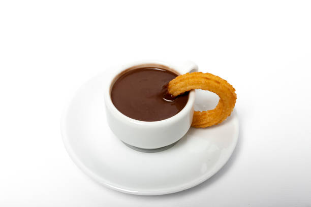 istock Cup of chocolate sauce with churros 1202774678