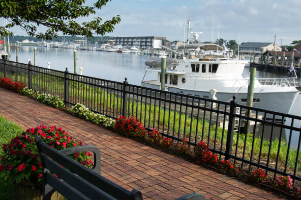 Boat on canal viewed from brick park path
