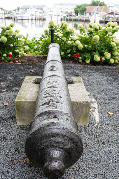 istock Old historic cannon mounted in park pointing towards water 1202776338