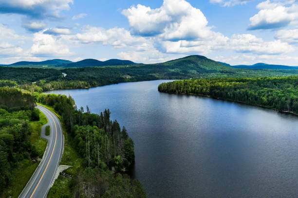 Road, Lake, Green Mountains, Vermont, USA Aerial photography of Vermont`s landscape. Winding roads, embraced by green and pure nature, lakes and mountains. road panoramic scenics journey stock pictures, royalty-free photos & images