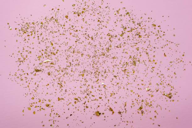 istock Pink festive background with golden confetti. 1202777267