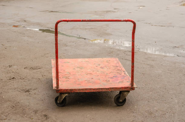 Used Painted with red color Enamel paint for Bringing goods. Shooting outdoors. Selective focus.