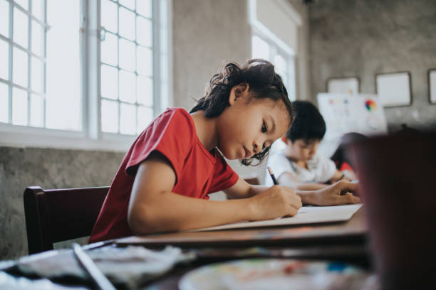 istock Thai children concentrate to draw idea and imagination with positive emotion while learning at the school 1202777773