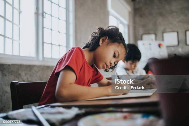 Thai Children Concentrate To Draw Idea And Imagination With Positive Emotion While Learning At The School Stock Photo - Download Image Now