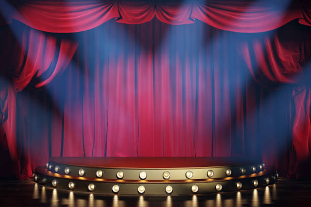 istock Theater stage with red velvet curtains and volume light. 1202779057