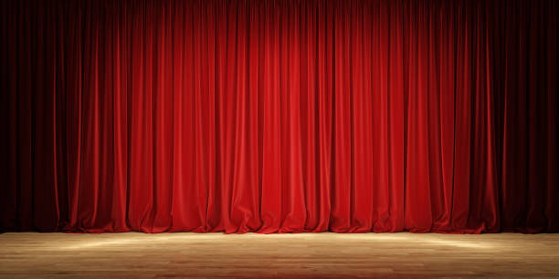 istock Empty theater stage with red velvet curtains. 1202779356