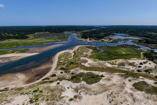 A scenic flight producing aerial shots of Cape Cod's beaches and its harbors, where you can find a bunch of sailors and fishermen.