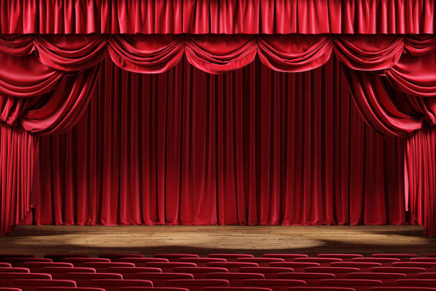 istock Empty theater stage with red velvet curtains. 1202779566