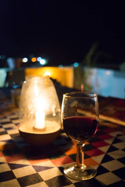 istock Red wine and candle 1202779837