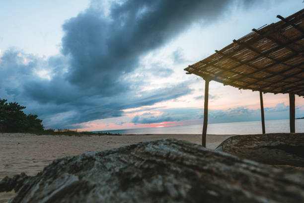 lake malawi  under dramatic sunrise sky