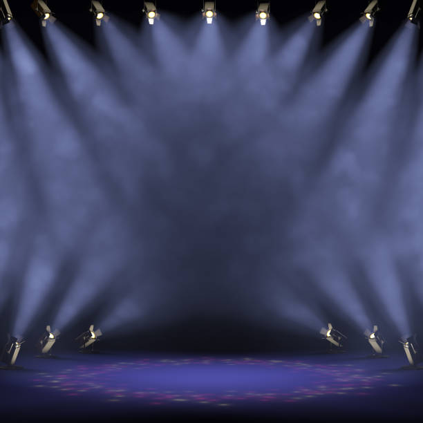 istock Stage light with colored spotlights and smoke. 1202781190