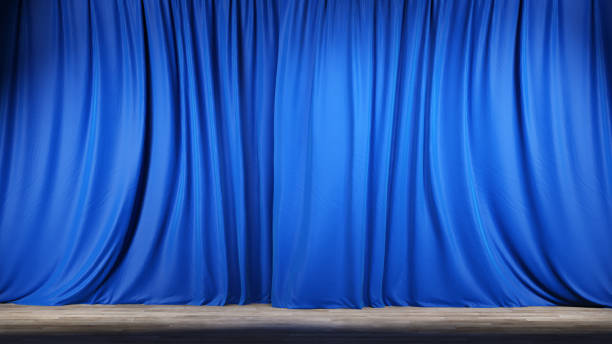 istock Empty theater stage with blue velvet curtains. 1202781359