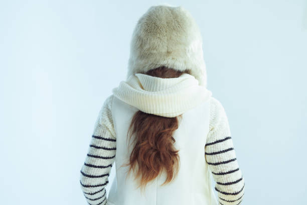 istock modern 40 years old woman on winter light blue background 1202781853