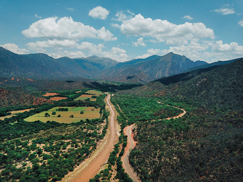 A scenic view from above on the road winding through the Andes mountains in Salta, Argentina.