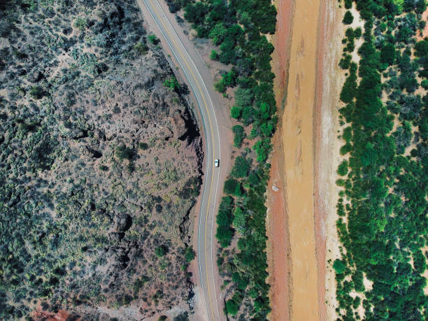 istock Aerial view on the winding road 1202786759