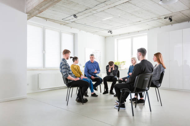 istock Social worker assisting students in lecture hall 1202789107